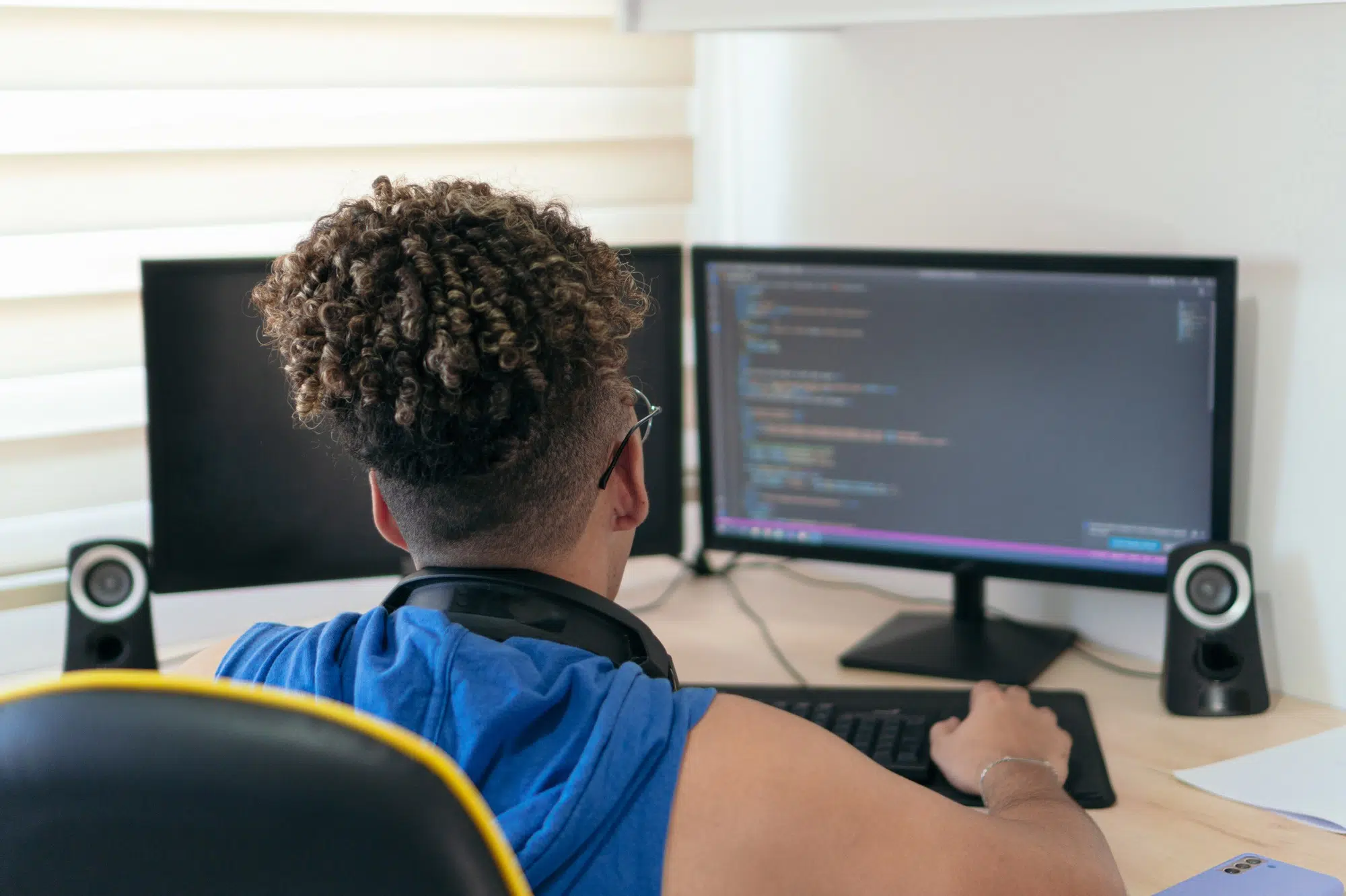 A website/software developer busy coding in his studio
